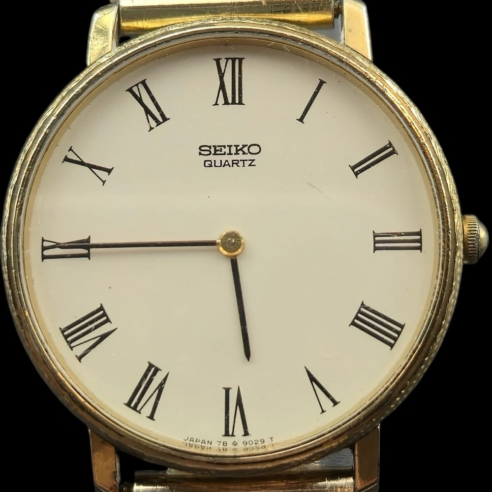 Seiko Gold Case White Dial Watch with Black Roman Numerals